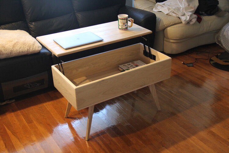 Coffee table with lift top